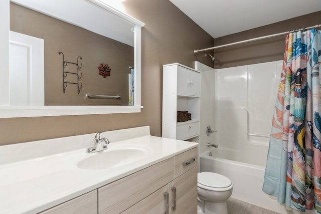 full bathroom featuring toilet, vanity, and shower / tub combo