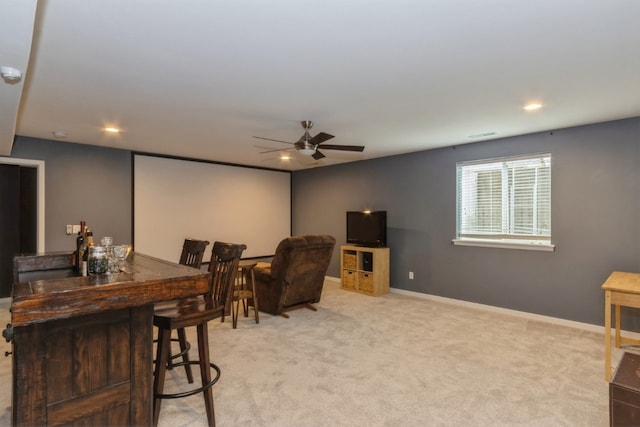 interior space featuring bar and ceiling fan