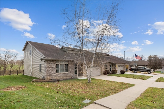 view of front of house with a front lawn and a garage