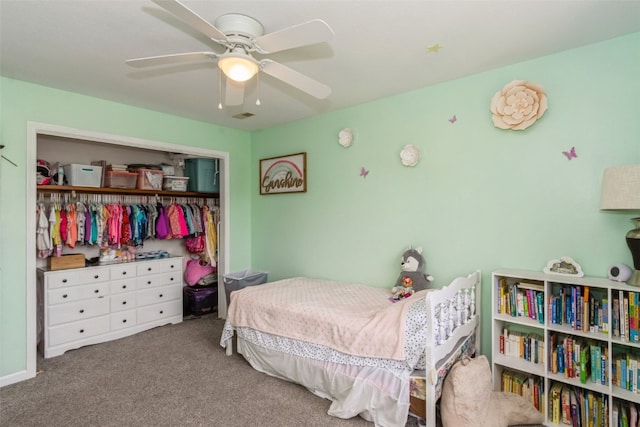 carpeted bedroom with ceiling fan and a closet