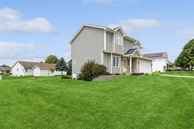 view of side of property with a garage and a yard