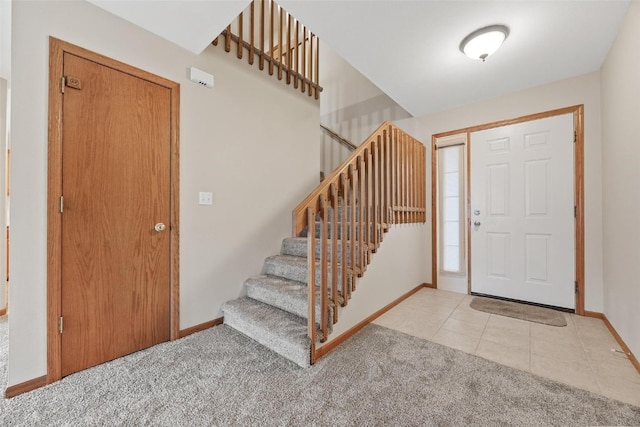 entryway with light colored carpet