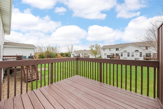 wooden deck with a lawn