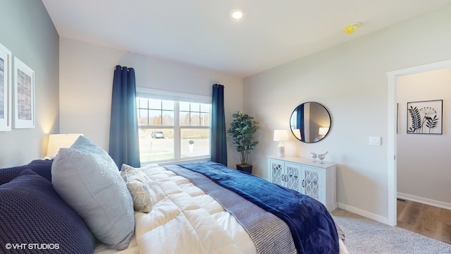 bedroom featuring light colored carpet