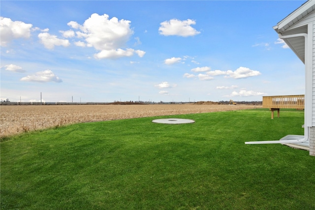 view of yard with a rural view