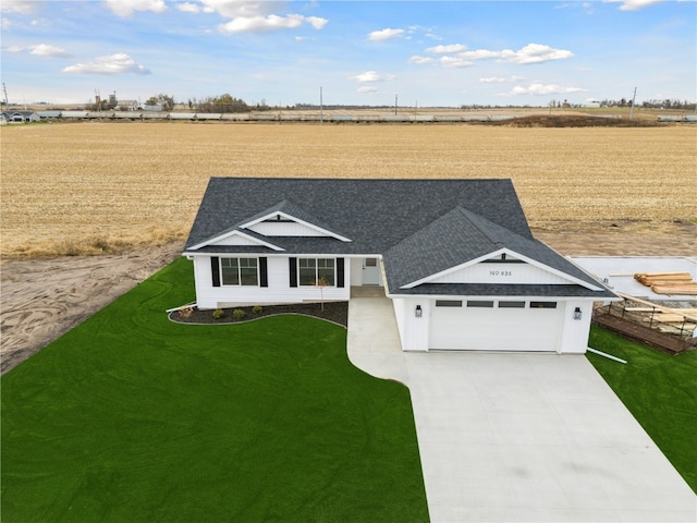 view of front facade with a garage and a front lawn