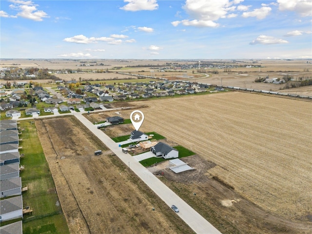 birds eye view of property with a rural view