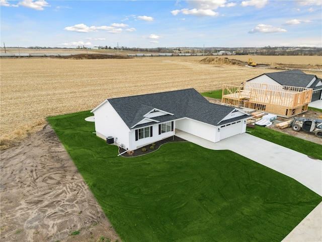 birds eye view of property with a rural view