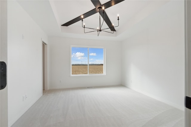 unfurnished room featuring light colored carpet, beam ceiling, a tray ceiling, and an inviting chandelier