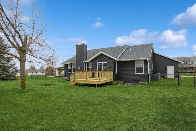 rear view of house featuring central AC, a yard, and a deck