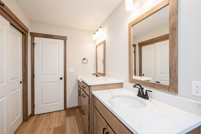 bathroom with vanity and hardwood / wood-style flooring