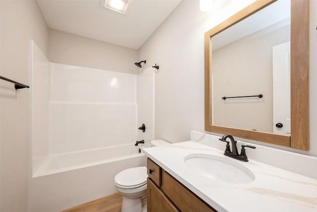 full bathroom with vanity, hardwood / wood-style floors, bathtub / shower combination, and toilet