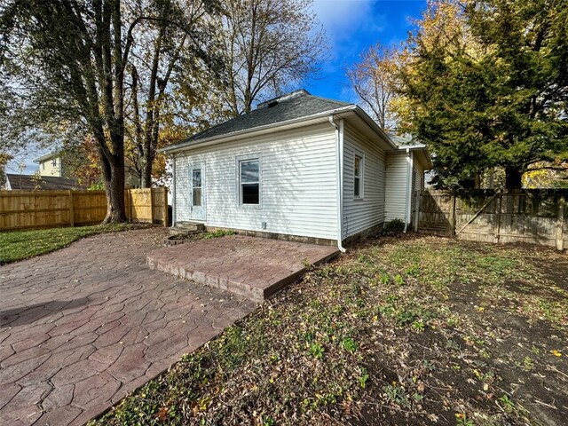 back of house with a patio area