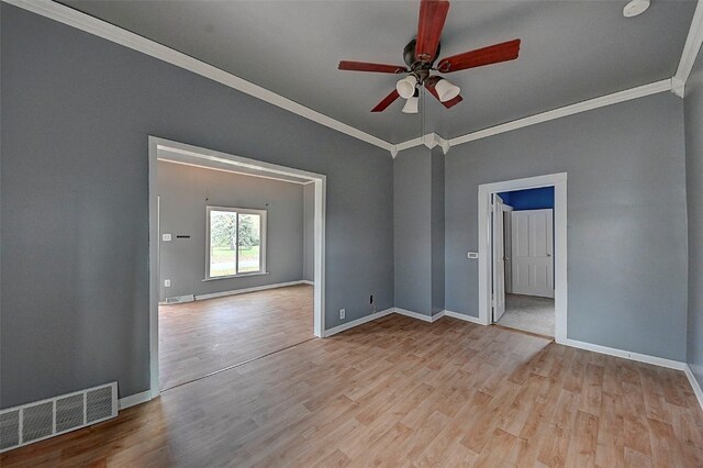 spare room with light hardwood / wood-style floors, ceiling fan, and crown molding