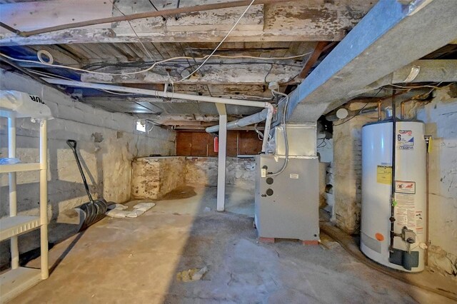 basement with gas water heater and heating unit