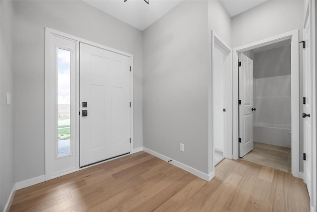 foyer entrance with light hardwood / wood-style flooring