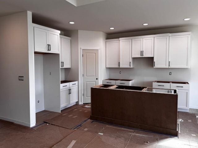 kitchen with a center island and white cabinets