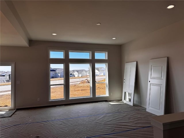 interior space with recessed lighting and baseboards