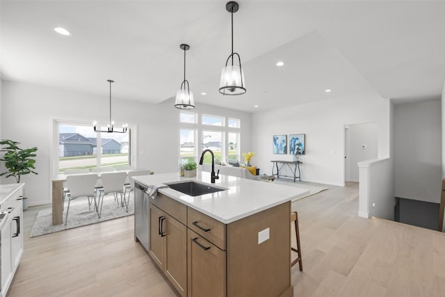 1930 Bowstring Dr, Marion, IA 52302 - kitchen featuring a chandelier, light wood-style floors, stainless steel dishwasher, light countertops, and recessed lighting