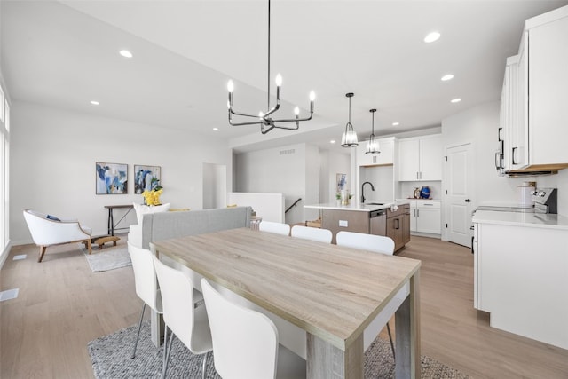 1930 Bowstring Dr, Marion, IA 52302 - dining space featuring recessed lighting, light wood-type flooring, and a chandelier