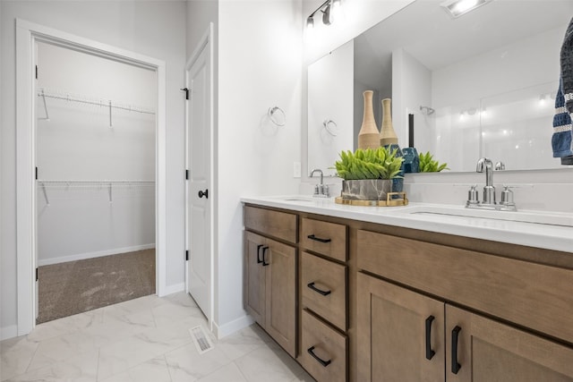 1930 Bowstring Dr, Marion, IA 52302 - full bath with double vanity, marble finish floors, and a spacious closet