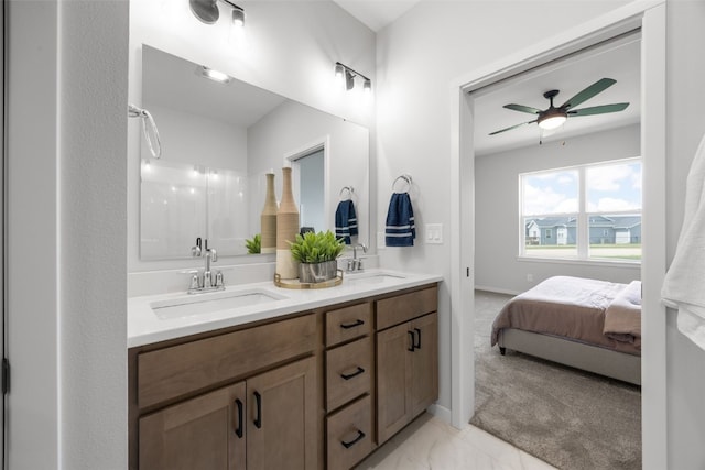 1930 Bowstring Dr, Marion, IA 52302 - ensuite bathroom with double vanity, a ceiling fan, and marble finish flooring