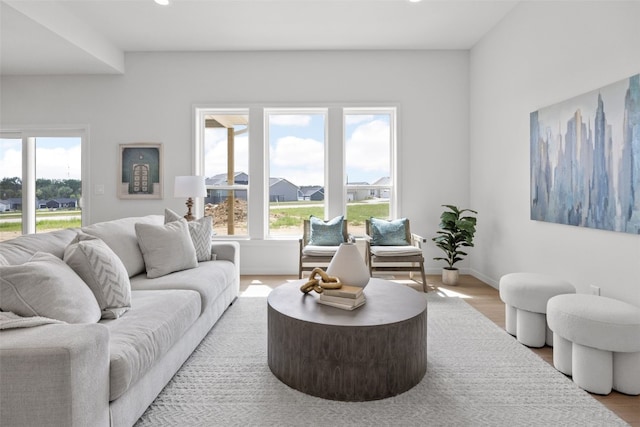 1932 Bowstring Dr, Marion, IA 52302 - living room featuring healthy amount of natural light, wood finished floors, recessed lighting, and baseboards