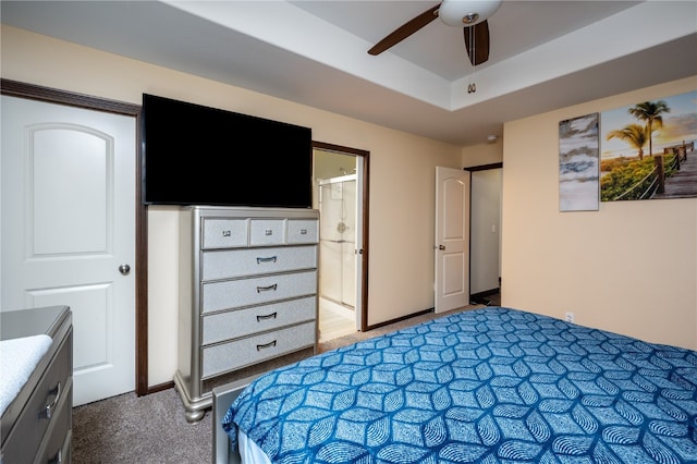 bedroom featuring connected bathroom, carpet flooring, and ceiling fan