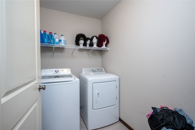 laundry room with independent washer and dryer