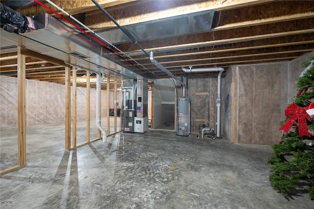 basement with water heater and heating unit