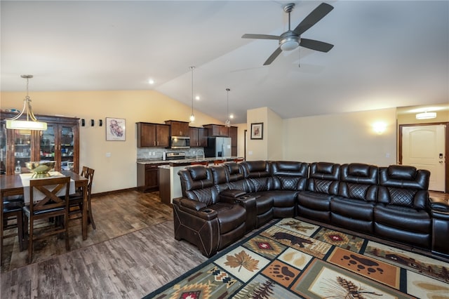 living room with dark hardwood / wood-style flooring, lofted ceiling, and ceiling fan