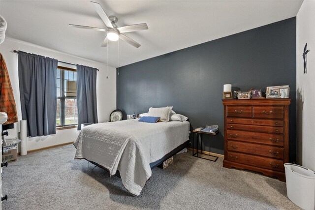 bedroom with ceiling fan and carpet floors