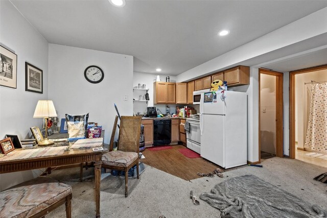 kitchen with hardwood / wood-style flooring and white appliances