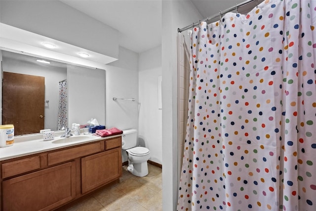 bathroom with toilet, vanity, a shower with shower curtain, and tile patterned floors