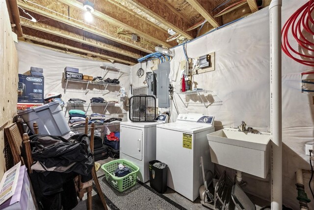 laundry room featuring sink, electric panel, and independent washer and dryer