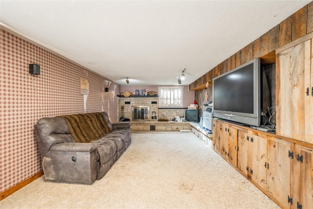 carpeted living room featuring a fireplace and wooden walls