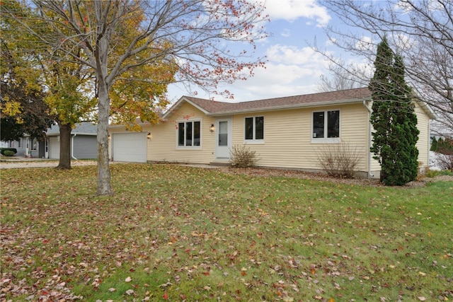 ranch-style house featuring a garage and a front yard