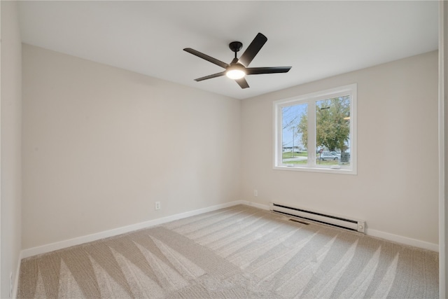 empty room with light carpet, ceiling fan, and a baseboard heating unit