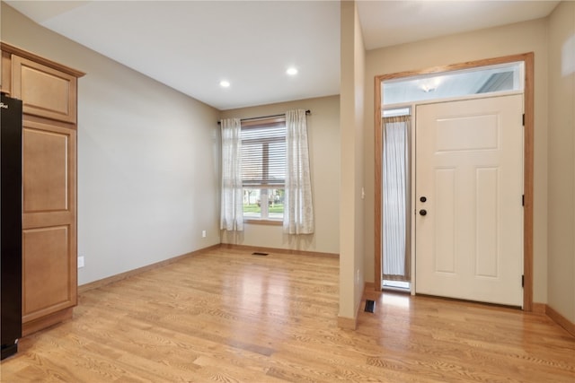 entryway with light hardwood / wood-style floors