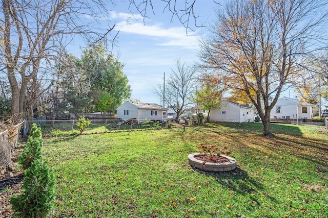 view of yard featuring an outdoor fire pit