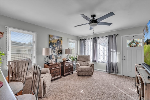 interior space with ceiling fan