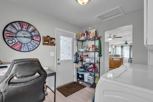 washroom with ceiling fan, washer and dryer, light hardwood / wood-style floors, and plenty of natural light