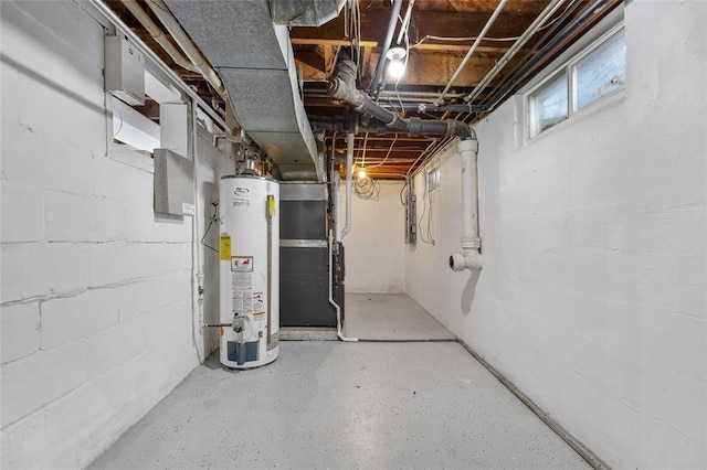 basement featuring water heater and heating unit