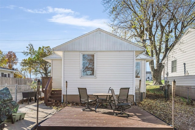 back of house featuring a deck