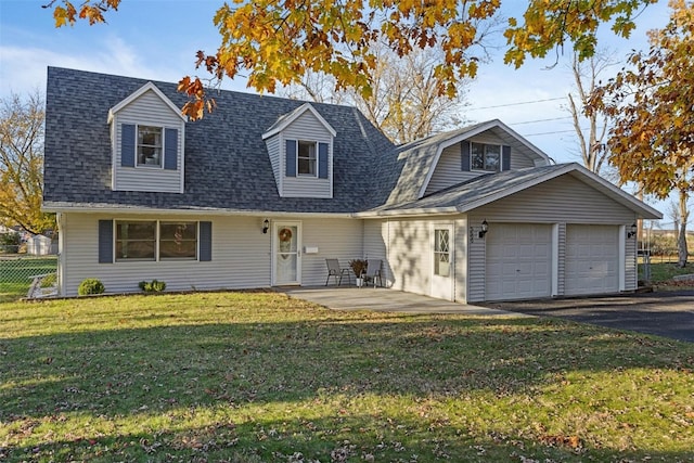 cape cod home featuring a garage, a front lawn, and a patio