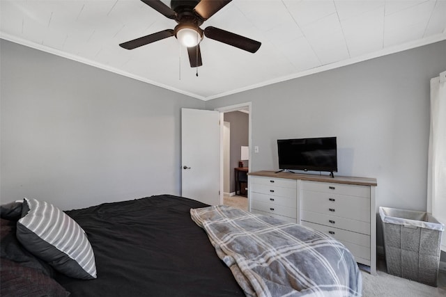 carpeted bedroom with ceiling fan and crown molding