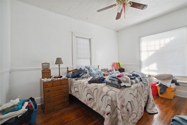 bedroom featuring wood-type flooring and ceiling fan