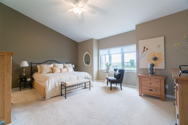 carpeted bedroom with vaulted ceiling and ceiling fan