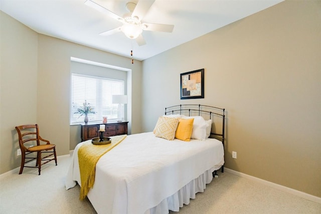 bedroom with ceiling fan and light colored carpet