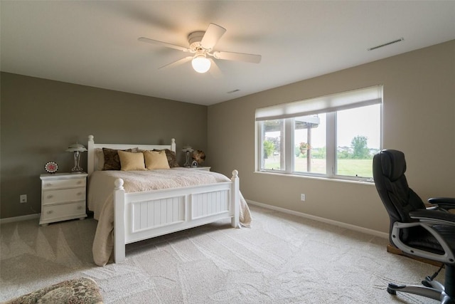 bedroom with ceiling fan and light colored carpet